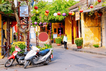 Cityscape with mopeds parked on street in Hoi An