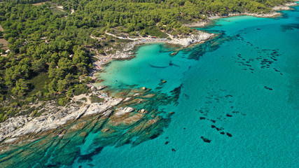 Fototapeta na wymiar Aerial drone photo of iconic turquoise paradise rocky beach of Kavourotripes in Sithonia Peninsula, Halkidiki, North Greece