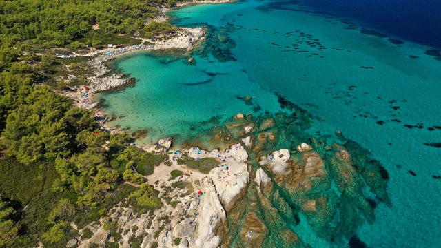 Aerial drone photo of iconic turquoise paradise rocky beach of Kavourotripes in Sithonia Peninsula, Halkidiki, North Greece © aerial-drone