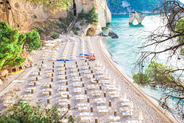 Fototapeta premium Mattinata Faraglioni stacks and beach coast of Mergoli, Vieste Gargano, Apulia, Italy.