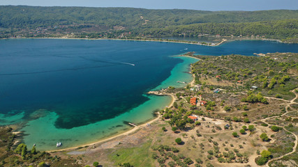 Aerial drone view of iconic Livari beach in natural exotic bay of Vourvourou, Sithonia peninsula, Halkidiki, Greece