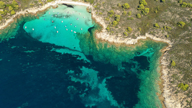 Aerial drone photo of iconic exotic sandy beach known as white beach in Diaporos island with turquoise clear sea, Vourvourou, Sithonia Peninsula, Halkidiki, North Greece © aerial-drone