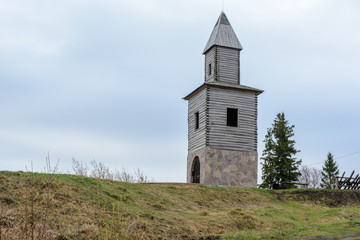 Fototapeta na wymiar Tetyushi, Tatarstan - May 2, 2019. A wooden observation tower on a high mountain on the coast of the Volga River. The tower is a copy of the tower built during the founding of the town Tetyushi.