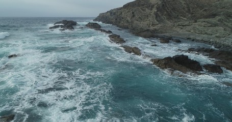 waves crashing on rocks