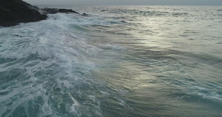 waves crashing on rocks
