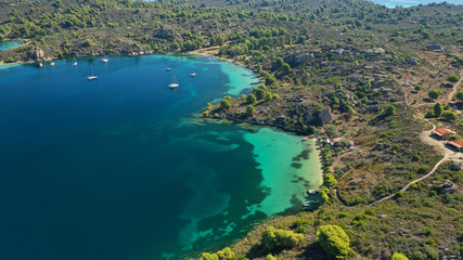 Naklejka premium Aerial drone photo of tropical Caribbean bay with white sand beach and beautiful turquoise and sapphire clear sea