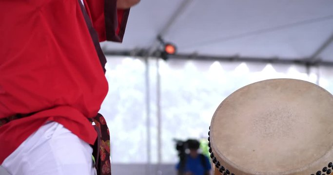 Young Japanese musician plays Taiko drum at cultural festival in Los Angeles downtown, California, 4K
