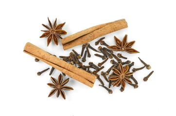 Cinnamon sticks, cloves and anise star isolated on white background close up. Spice Cinnamon sticks dried cloves and anise star.