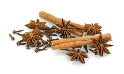 Cinnamon sticks, cloves and anise star isolated on white background close up. Spice Cinnamon sticks dried cloves and anise star.