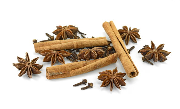 Cinnamon sticks, cloves and anise star isolated on white background close up. Spice Cinnamon sticks dried cloves and anise star.