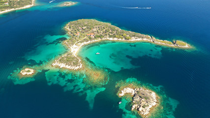 Fototapeta na wymiar Aerial drone photo of turquoise bay near famous Vourvourou and Diaporos island, Sithonia peninsula, Halkidiki, North Greece