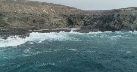 waves crashing on rocks