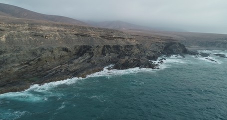 waves crashing on rocks