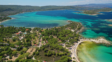 Aerial drone panoramic photo of iconic bay with turquoise frozen waves of Vourvourou in Sithonia Peninsula, Halkidiki, North Greece