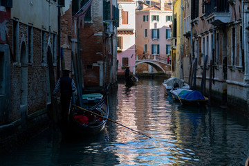 Fototapeta na wymiar Venezia (Venice), Italy. 2 February 2018. Gondolas and boats on the rivers of Venice.