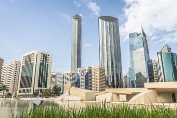 Qasr Al Hosn fort museum in front of skyscrapers in Abu Dhabi, UAE