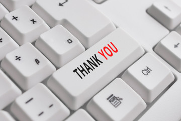 Writing note showing Thank You. Business concept for a polite expression used when acknowledging a...