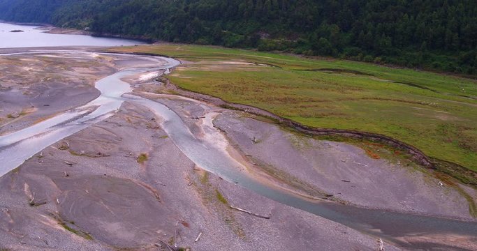 low-level flight on a cloudy day, in the delta of the river that feeds the waters of Lake Caburgua
