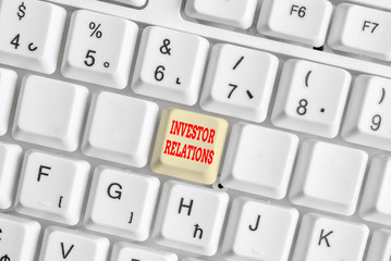 Conceptual hand writing showing Investor Relations. Concept meaning analysisagement responsibility that integrates finance White pc keyboard with note paper above the white background