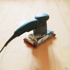 wooden floor sanding with flat sander tool