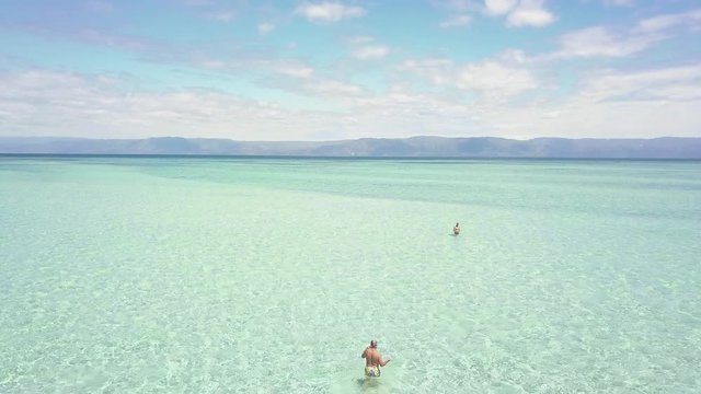 Drone scenic flyover of miles of uncrowded sandbar in the Philippines.