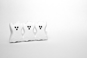 white ghosts on white background