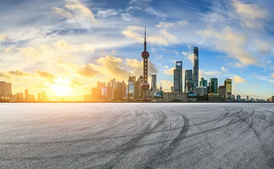  Empty race track and modern city scenery at sunrise in Shanghai,China. © ABCDstock