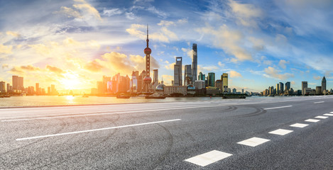Empty highway and beautiful city buildings scenery at sunrise in Shanghai,China.