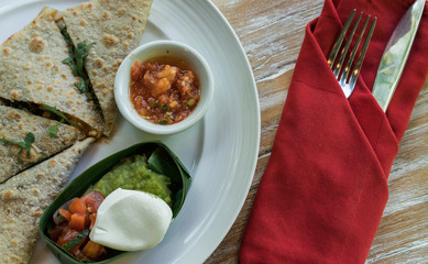 Vegan tortilla wrap, with vegetabes on a wooden background