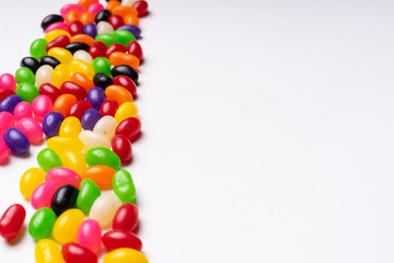 colorful jelly beans candies white background Top view