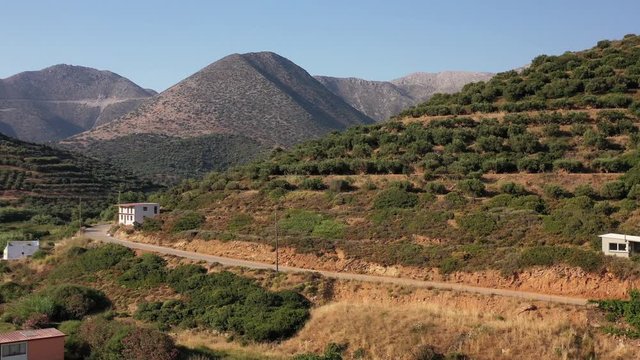Aerial video of cretan landscapes. Olive groves on the hils and mountain slopes. Crete, Greece.