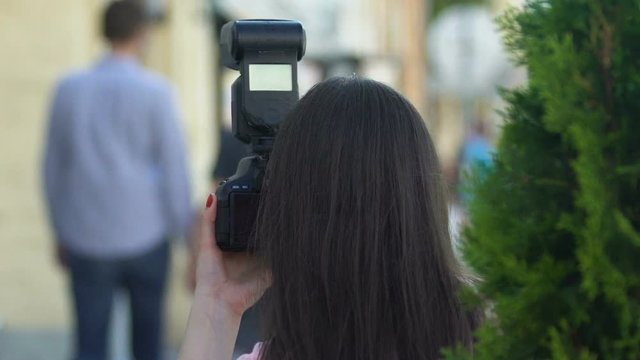 Photojournalist taking secret photos of celebrity walking street, exclusive news