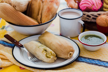 mexican tamales of corn leaves with green sauce and atole, Tamales Breakfast in Mexico