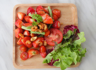 Delicious strawberry salad with tomatoes and fresh vegetable