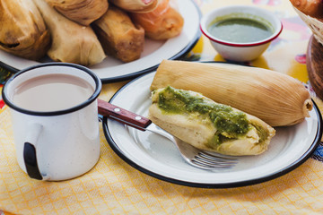 mexican tamal of corn leaves with chili and green sauce, Tamale in Mexico