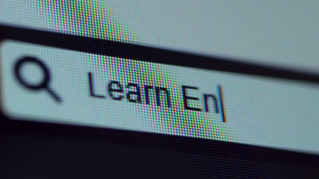 Browser bar with Learn Engish text typed on the computer screen. Shot in 4k resolution