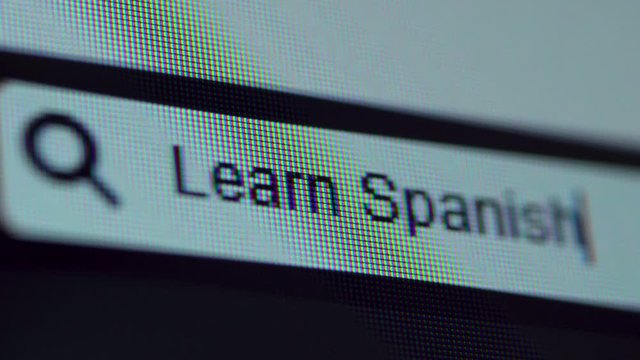 Browser bar with Learn Spanish text typed on the computer screen. Shot in 4k resolution
