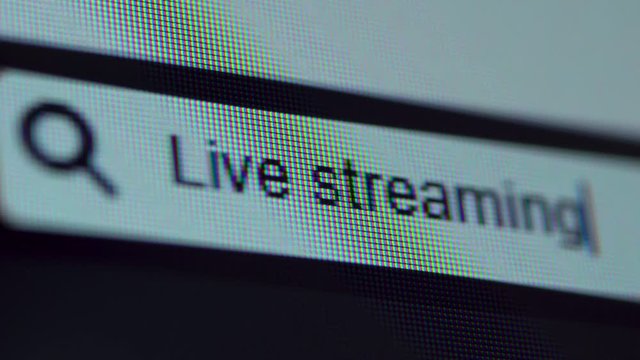 Browser bar with Live Streaming text typed on the computer screen. Shot in 4k resolution