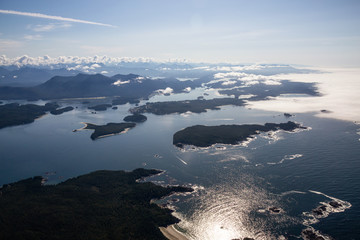 Aerial Landscape View of a touristic town, Tofino, on the Pacific Ocean Coast during a sunny summer morning. Taken in Vancouver Island, British Columbia, Canada.