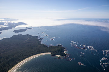 Aerial view of a beautiful sandy beach on the Pacific Ocean Coast during a sunny summer morning. Taken in Vargas Island, near Tofino, Vancouver Island, BC, Canada.