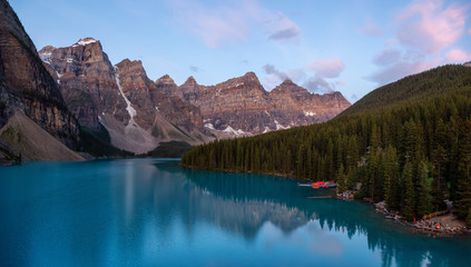 Fototapeta na wymiar Beautiful view of an Iconic Famous Place, Moraine Lake, during a vibrant summer sunrise. Located in Banff National Park, Alberta, Canada.
