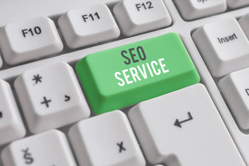 Handwriting text writing Seo Service. Conceptual photo techniques and procedures to increase the...