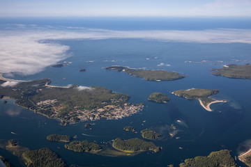 Aerial Landscape View of a touristic town, Tofino, on the Pacific Ocean Coast during a sunny summer morning. Taken in Vancouver Island, British Columbia, Canada.