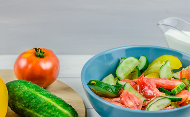 salad with cucumbers and tomatoes on white background