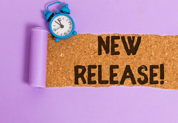 Writing note showing New Release. Business concept for announcing something newsworthy recent...