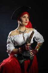 Woman pirate in hat, white blouse and red skirt