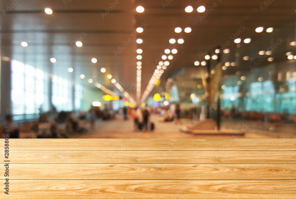 Poster wood table in conference hall background with empty copy space for product display.