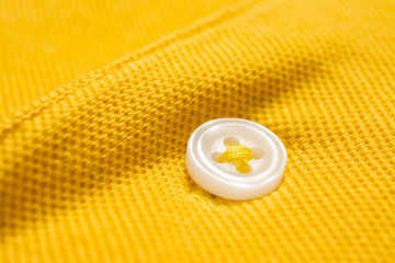 Yellow polo shirt texture, cotton fabric. Textile background