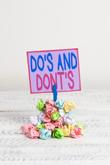 Conceptual hand writing showing Do S And Dont S. Concept meaning Rules or customs concerning some...