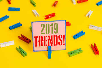 Word writing text 2019 Trends. Business photo showcasing general direction in which something is developing or changing Colored clothespin papers empty reminder yellow floor background office